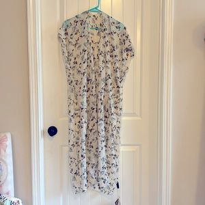 Multiple use wrap. Can be worn as a dress, a top or over a dress. Never worn.